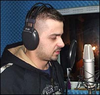 Genc rapping in his studio