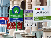 For sale signs on houses