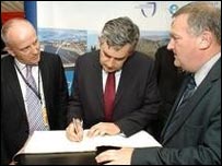Gordon Brown signing the Book of Life at the Labour Party Conference in 2008 