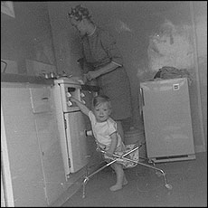 Woman and baby in a kitchen