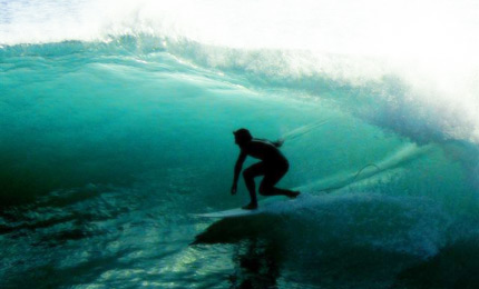 Touchy feely. Australias finest Joe Williams just makes this kind of wave look too easy. Pic Amy Williams, Feb 07