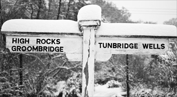 Signpost with snow by Robert Moseley