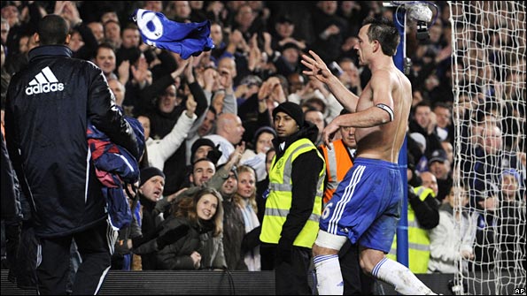 John Terry throws his Chelsea shirt into the crowd