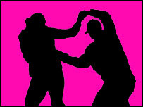 Silhouettes of people dancing against a coloured background