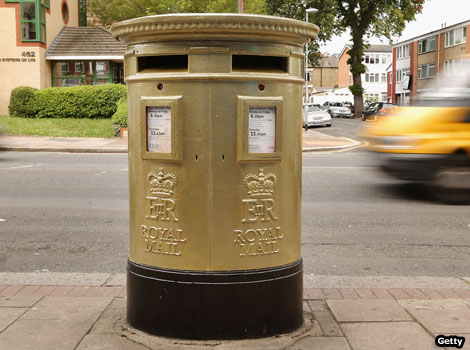 A gold post box in Isleworth, London.