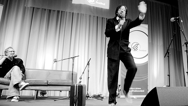 Jason Byrne watches Brian Gittins performing