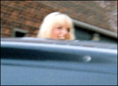 Girls Aloud Sarah peeps over the car roof!