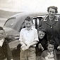 John's at Rathmullan with his siblings and mum, Hannah. He's second from the left displaying shells that he'd collected. The bonnet of the car was open as John says his Father was probably 'tinkering with it'