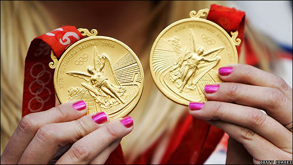 Rebecca Adlington shows off her two gold medals from the 2008 Olympics