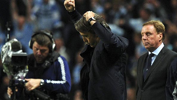 Mancini punches the air during City's win over Spurs. Photo: Reuters