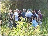 People walking in a meadow