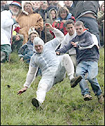 Cheese rollers falling down Cooper's Hill