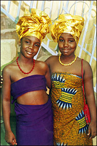 Two young Nigerian girls arm in arm