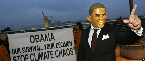 President_Obama_mask_with_protest_banner