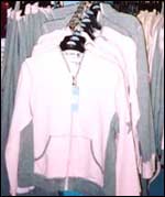 Claire trying on clothes