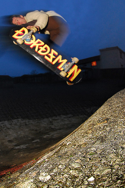 The 'crete alternative. Hard landing, new board and real nice Clancy steeze tweeds for Jay, mid air, Feb 08. Pic m