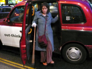 Journey completed, Kate negotiates getting out of the cab