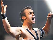 Oblivion raises his arms.