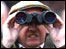 A racing fan with binoculars (GETTY IMAGES)