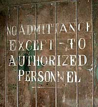 Still visible on an inside door - a warning that this place was secret.