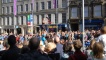 A busy Monday at the festival and crowds gather to watch street performers on the Royal Mile