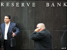People walk past the Reserve Bank of Australia (RBA) in Sydney on August 14, 2009