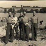 Photograph from Lieutenant James Patrick Heenan, Prisoner-of-War No.1106 (Oflag VIIC, Bataillon 2) Oflag VI — B Germany showing Lieutenant James Patrick Heenan to the right hand side of standing group of prisoners (Photograph by Dr. Jung) Photograph from Lieutenant James Patrick Heenan, Prisoner-of-War No.1106 (Oflag VIIC, Bataillon 2) Oflag VI — B Germany showing Lieutenant James Patrick Heenan to the right hand side of standing group of prisoners (Photograph by Dr. Jung)