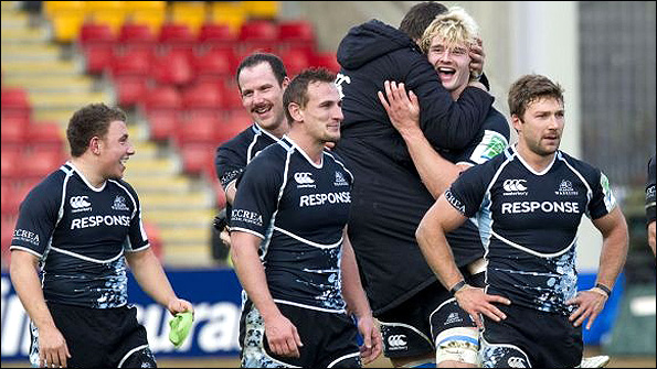The Glasgow Warriors players show their delight at Richie Gray's match-winning try at Firhill. Photo: SNS