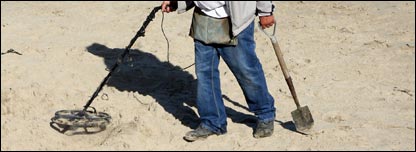 A man using a metal detector