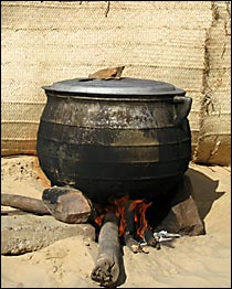 Cooking pot on wood fire.