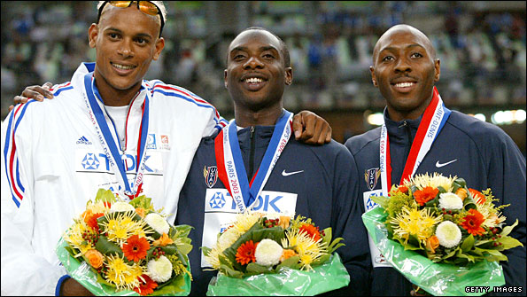 Washington's friend Young (centre) beat him into silver in 2003 but subsequently admitted doping