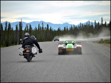 Claudio Von Planta filming the supercar from the back of a motorcycle