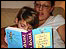 A parent reading to her child