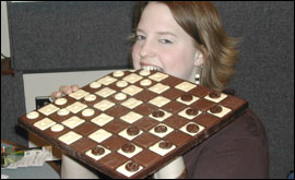Prudence Emma Staite with chocolate draughtboard