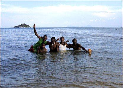 Malawi: A group of students enjoy a relaxing dip in Lake Malawi's Senga Bay, an area just outside the capital, Lilongwe, popular with tourists.