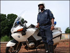 BBC Africa Kicks bus gets a police escort in Benin