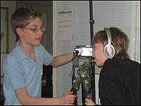 Two students setting up their camcorder