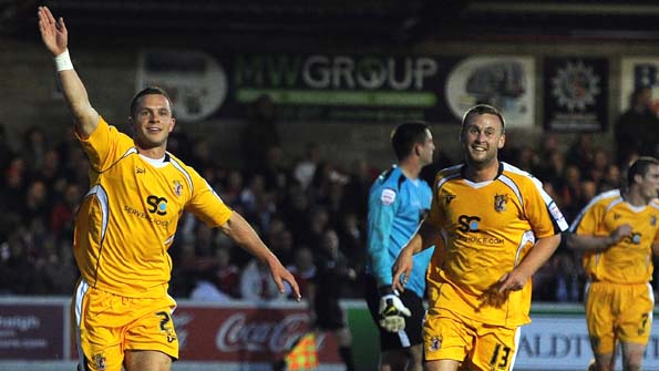 Stevenage celebrate after Chris Beardsley (left) scores the opener against Accrington Stanley