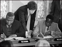 Joshua Nkomo and Robert Mugabe sign a ceasfire at Lancaster House in London 1979