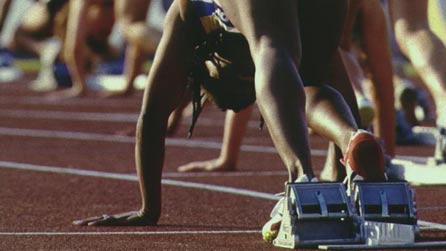 Athlete on starting blocks Athlete on starting blocks