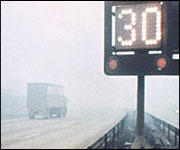 snowy motorway, lorry and speed restriction