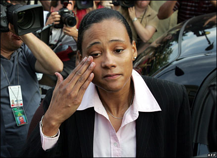 Marion Jones wipes tears from her eyes after admitting perjury at a New York court