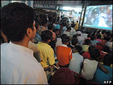 India cricket fans watching a game on TV