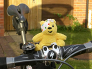 Pudsey toy on bicycle handlebars