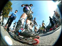 People skating in the street.