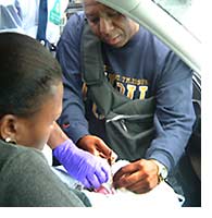 Image: Mike cutting Amaiya's umbilical cord