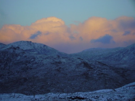 Sunrise strikes mushrooming clouds over Harris Hills