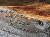 Aerial image of Woden Law Iron Age hill fort dusted by snow. Photo courtesy of RCAHMS.