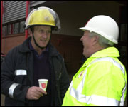 Robin Bryant talking to a Firefighter