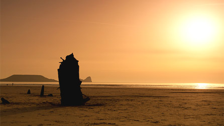 Sunset by Chris Aylward at Rhossilli beach on Gower.